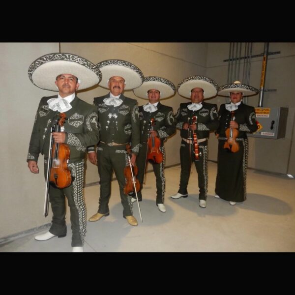 Musician posing with their long shaped round hats and guitars