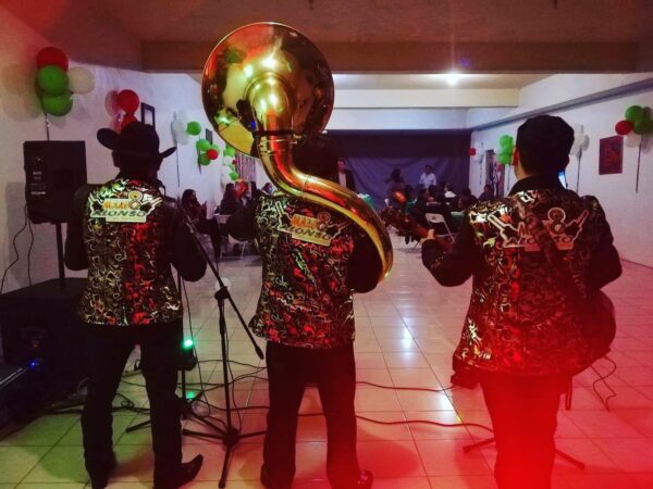 Musicians in glittering dress holding their instruments