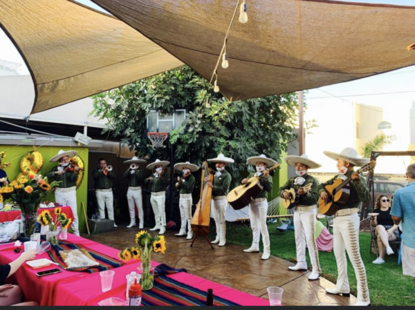 Musicians performing their instruments near the judge