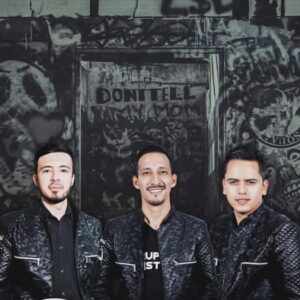 A close shot of musician band posing black and black dress combo