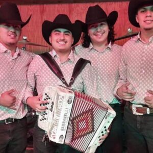 Musician playing accordion and others posing for picture