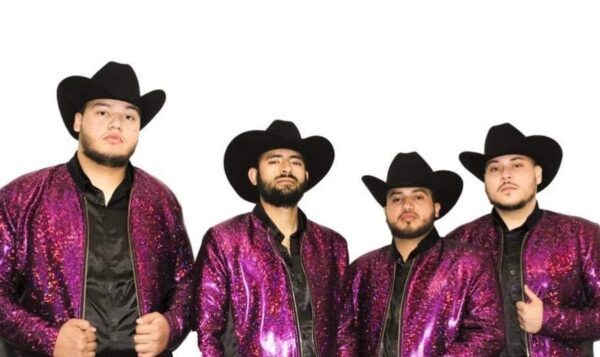 Musicians in glittering pink jackets and cow boy hats