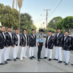 A man posing for a picture with musician band