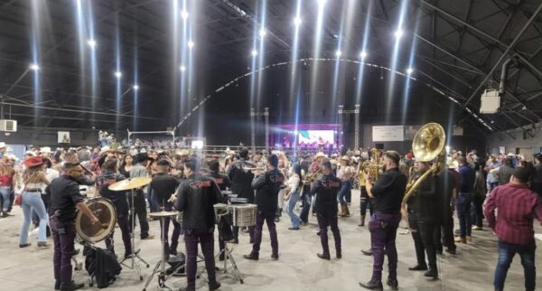 Band performing their instruments in a crowd