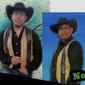 All musicians dressed in black and yellow combo with cow boy hats posing