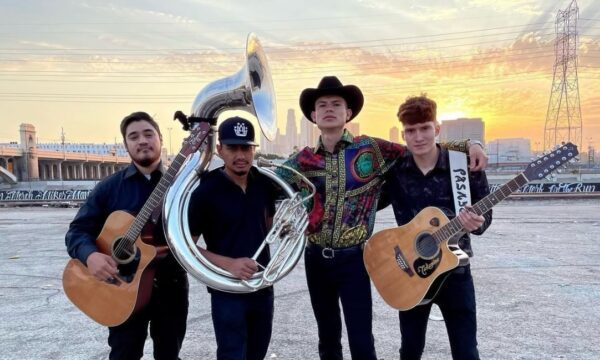 Group of musicians posing with their classical guitar and French horn