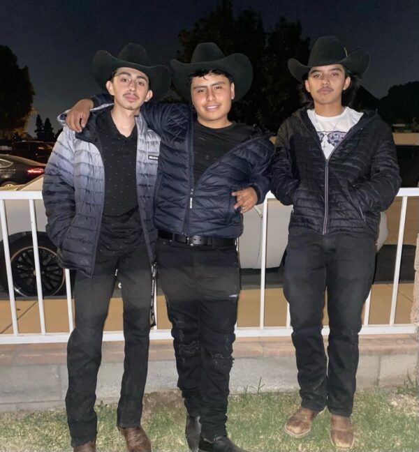 Musicians with cow boy hat and jackets posing