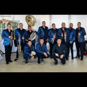 Music band posing for picture with their trumpet