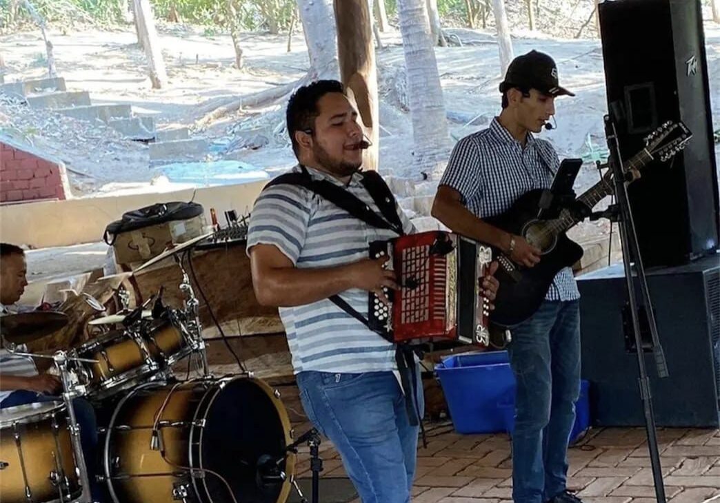 Musicians playing snare drum and bass guitar