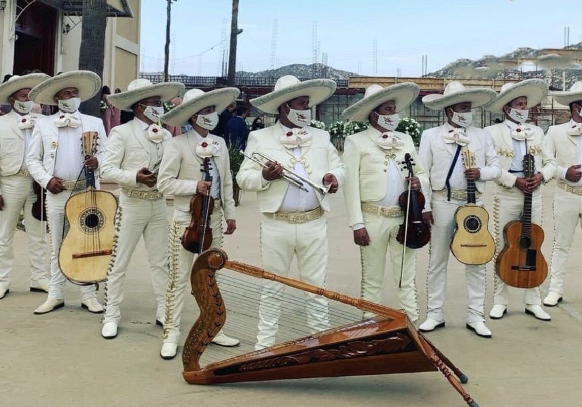 All musicians in white dress code waiting to welcome guests with their instruments