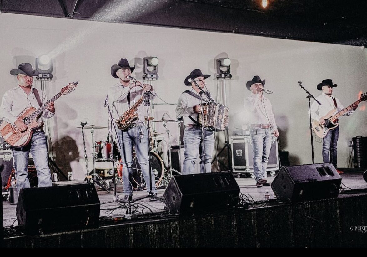 An old picture of musicians performing on stage