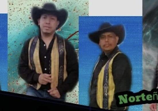 All musicians dressed in black and yellow combo with cow boy hats posing