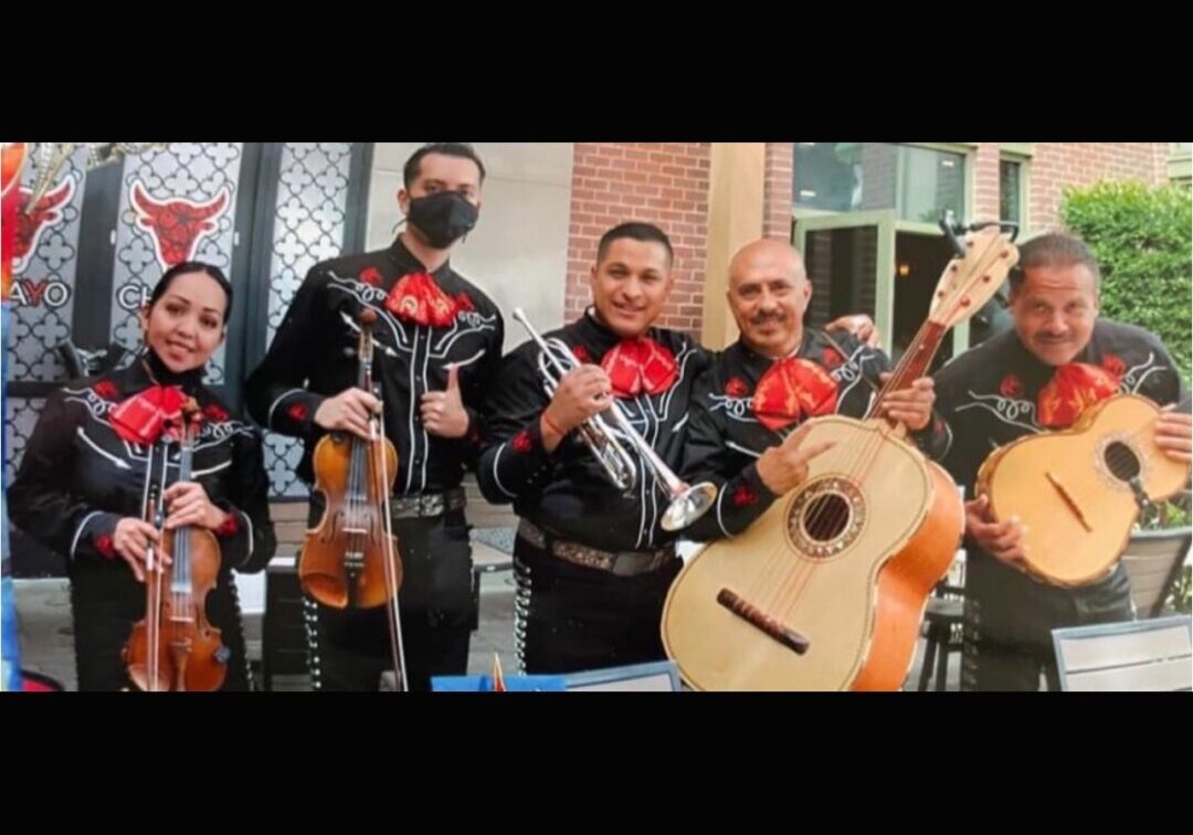 Mariachis LV band with red color bow on their neck
