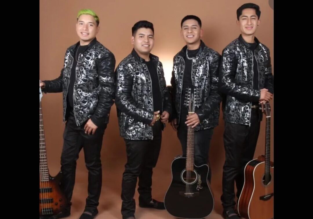 music band all dressed up in black and posing with their guitars