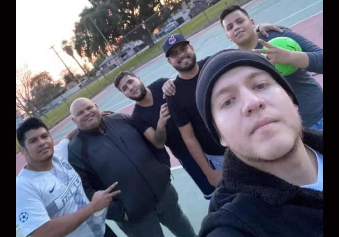 Music band taking selfie at the ground